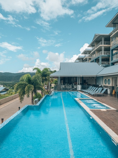 Peppers Airlie Beach Review: The Infinity Pool. The Peppers Airlie Beach Resort has an incredible infinity pool as seen here. It was one of my favourite parts of the resort.
