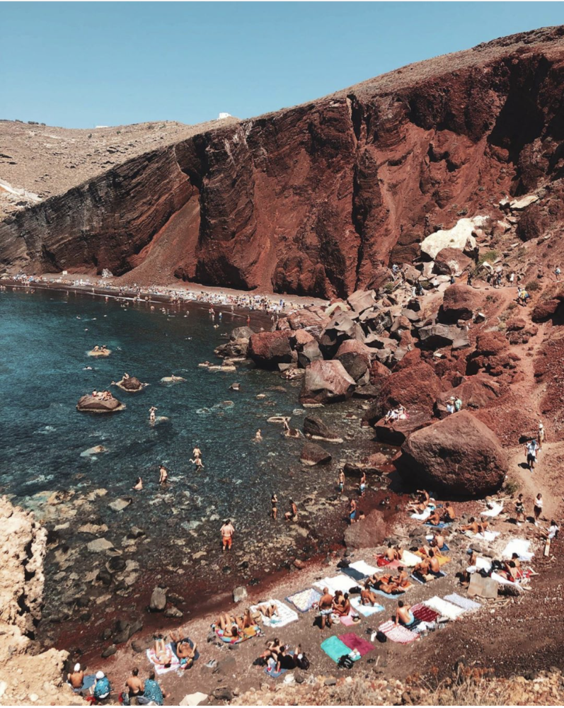 The best photo spots and most instagrammable places in Santorini: Red Beach in Akrotiri. Click the photo to see the rest of my list of the best instagram photo spots in Santorini!
