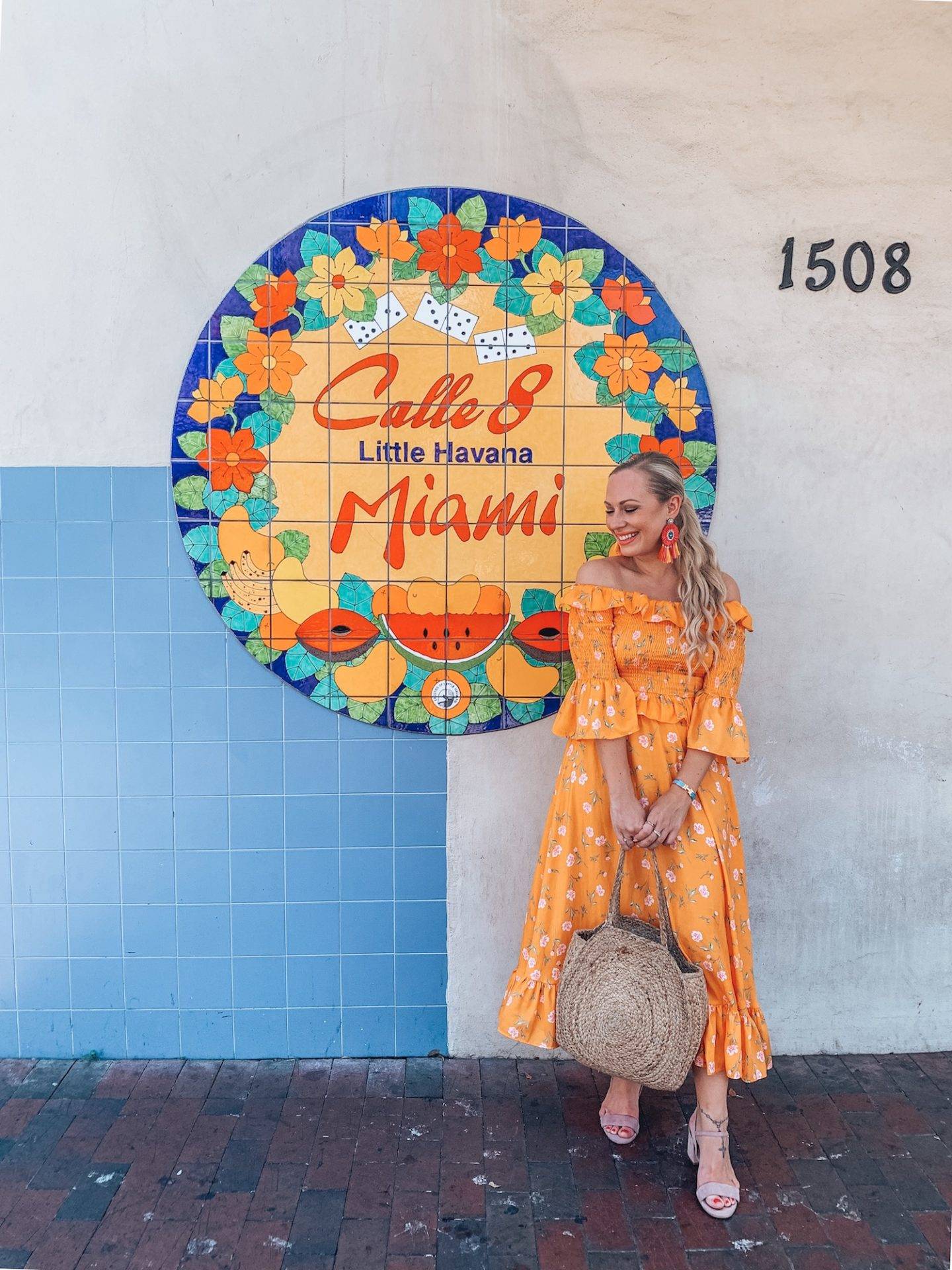 How to spend 1 perfect day in Little Havana, Miami. A complete guide on what to see and do, which restaurants to dine at, bars to visit, Cuban treats to try and more. If you're headed to Little Havana for the day you'll definitely want to read this guide! Pictured here: You must visit the famous Calle Ocho in Little Havana Miami.