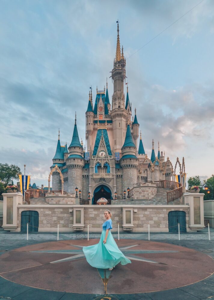 Twirling in front of Cinderella's Castle. Click the photo for a complete guide on how to get the perfect photo at Disney! Includes a list of all the top Disney World photo spots. via www.kirstenwendlandt.com