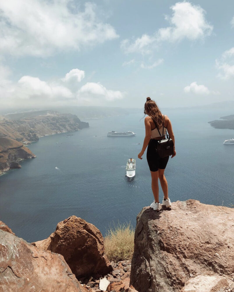 The best photo spots and most instagrammable places in Santorini: Skaros Rock in Imerovigli. Click the photo to see the rest of my list of the best instagram photo spots in Santorini!