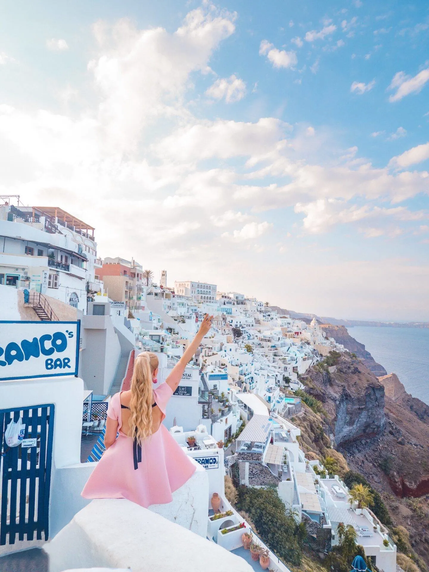 The best photo spots and most instagrammable places in Santorini: Cliffside view of Fira. Click the photo to see the rest of my list of the best instagram photo spots in Santorini!