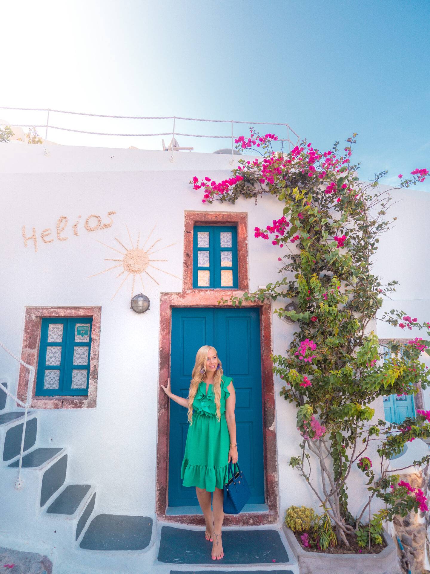 The best photo spots and most instagrammable places in Santorini: Colourful doors of Oia. Click the photo to see the rest of my list of the best instagram photo spots in Santorini!