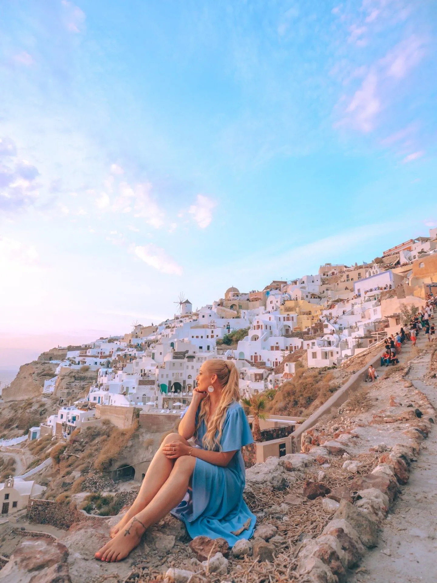 Dying to visit Santorini but think it's the kind of trip that's lavishly expensive? Visiting Santorini on a budget is completely possible and I'm here to tell you how! From flight and hotel bookings to dining and activity recommendations, read this guide to find out exactly how you can visit Santorini on a budget. Pictured here: Catching the sunset in Oia at Byzantine Castle Ruins