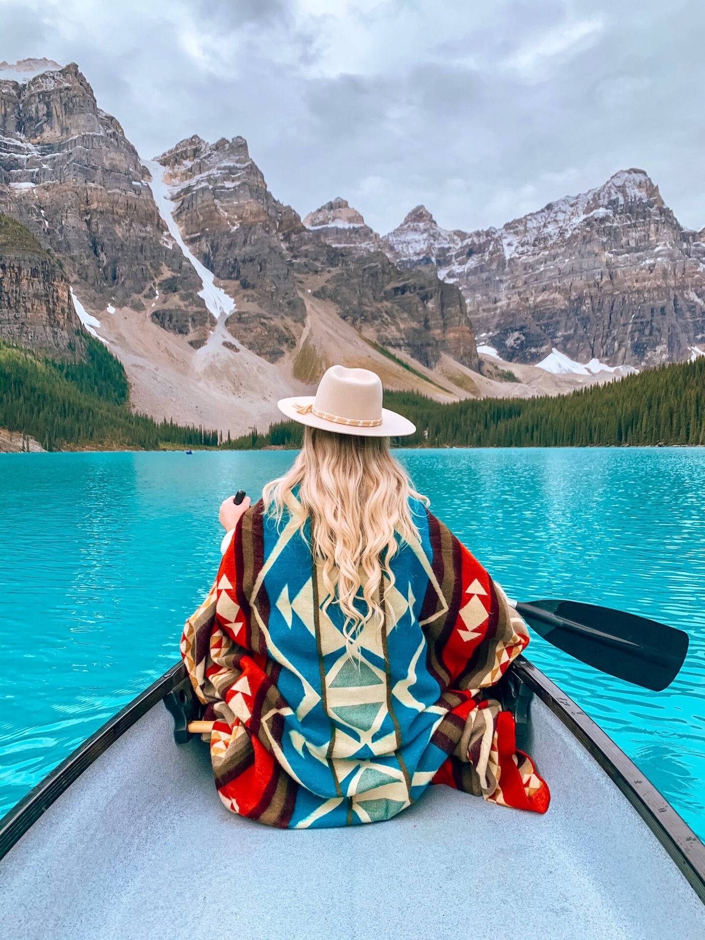 Visiting Banff National Park soon? Don't miss this guide of the 50 best things to in Banff for every kind of traveler! I recently spent 8 days exploring the area and took notes along the way so I could write you the most comprehensive guide possible. This guide includes all the top attractions, hikes, restaurants, and sights you definitely won't want to miss when you visit Banff National Park. I also include any tips you might need when visiting the area! Pictured here: Canoeing on Moraine Lake