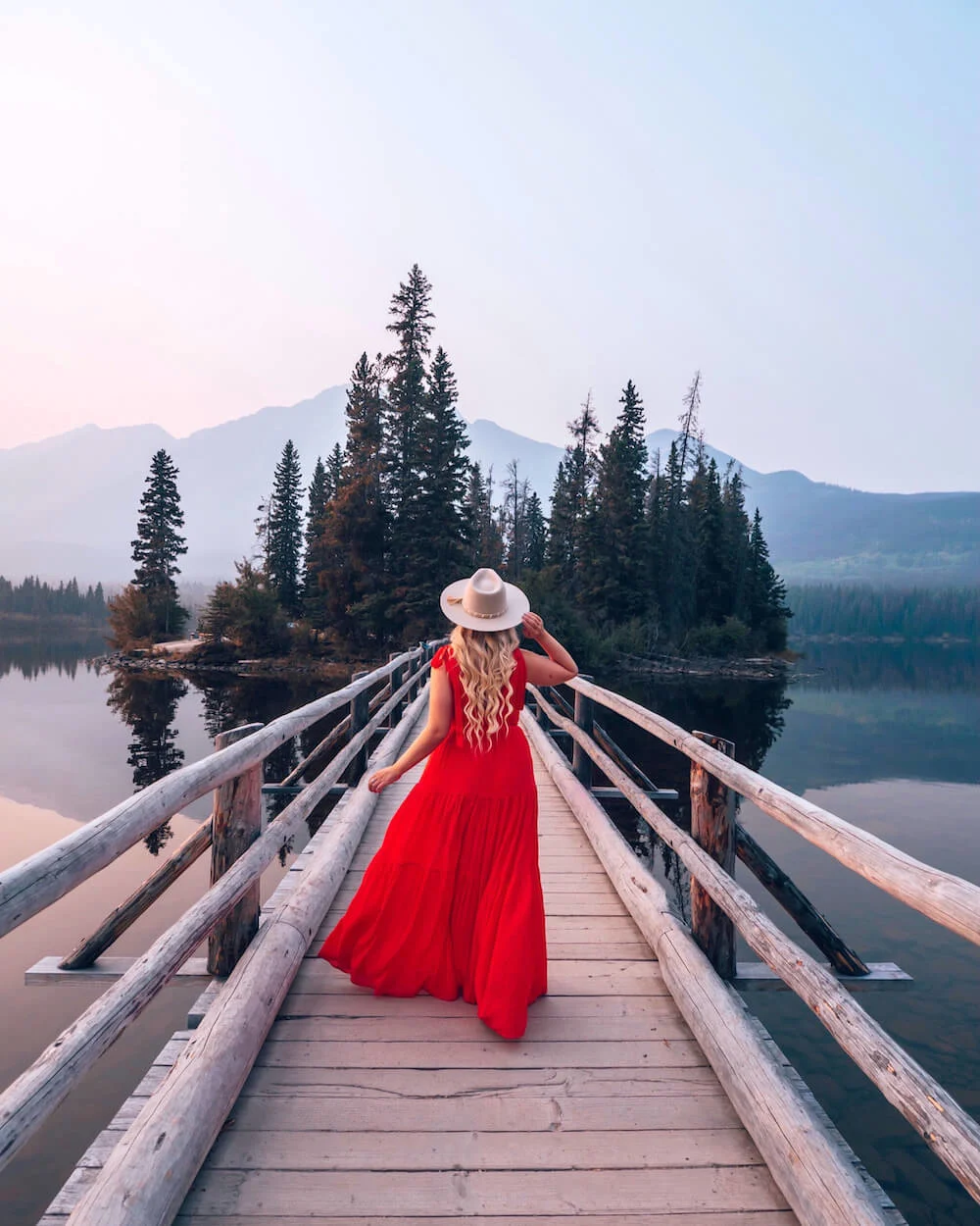 Planning a trip to Jasper National Park soon? Here's a local's guide to some of the best things to do in Jasper. From hikes and trails to adventure sports, family friendly excursions, dining experiences and more. You won't want to miss this guide of the best things to do and places to see in Jasper. Pictured here: Pyramid Island