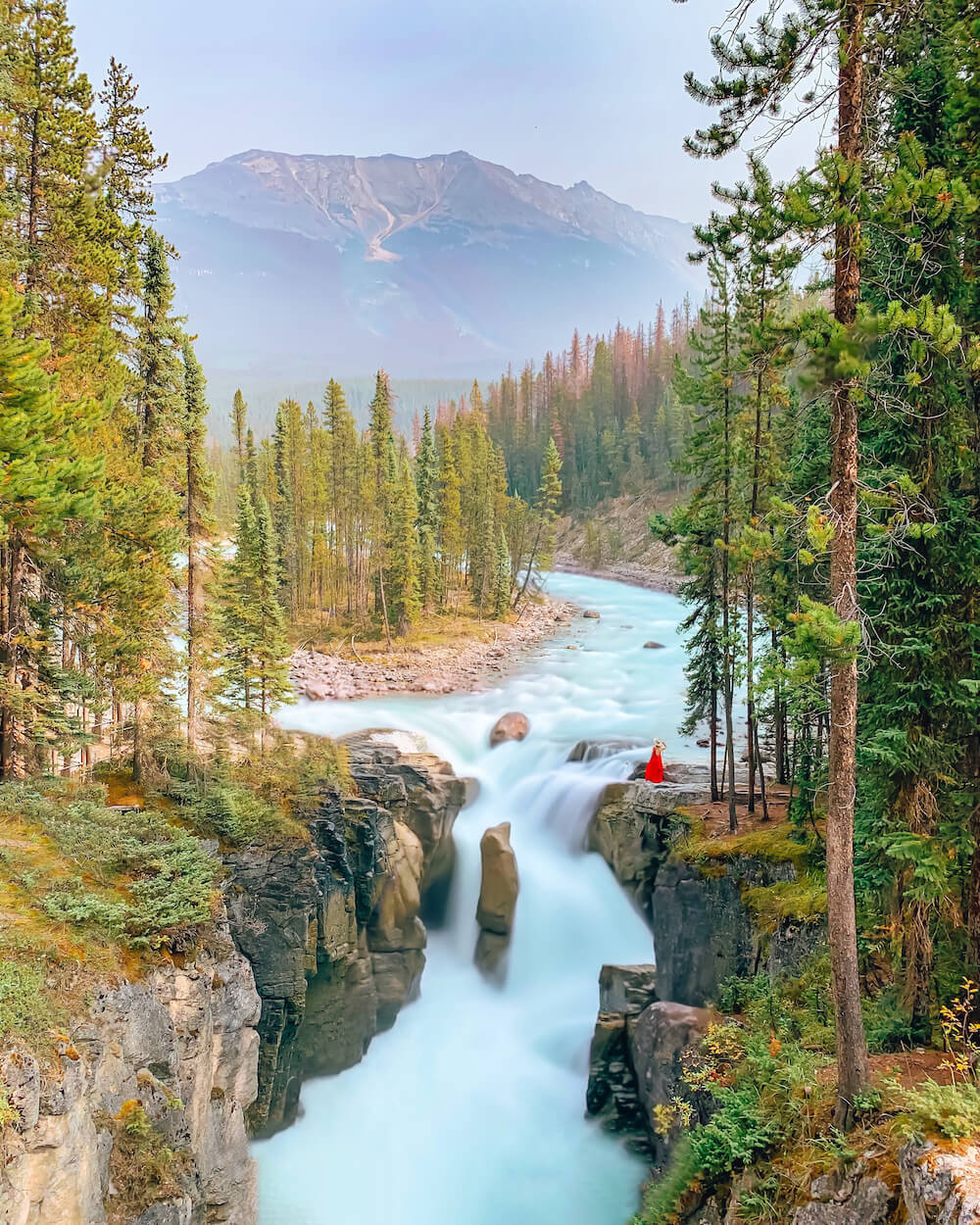 Planning a trip to Jasper National Park soon? Here's a local's guide to some of the best things to do in Jasper. From hikes and trails to adventure sports, family friendly excursions, dining experiences and more. You won't want to miss this guide of the best things to do and places to see in Jasper. Pictured here: Sunwapta Falls