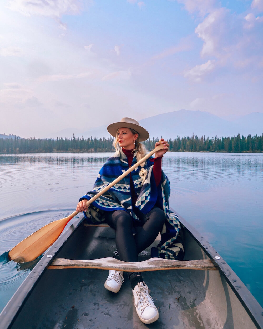 Planning a trip to Jasper National Park soon? Here's a local's guide to some of the best things to do in Jasper. From hikes and trails to adventure sports, family friendly excursions, dining experiences and more. You won't want to miss this guide of the best things to do and places to see in Jasper. Pictured here: Canoeing on Lac Beauvert