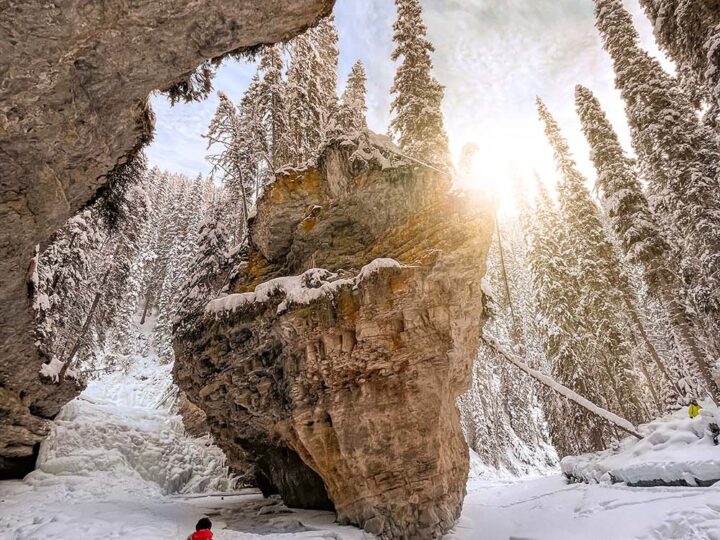 Experiencing the wonders of the Johnston Canyon ice walk is something you absolutely have to do when visiting Banff during the winter months. This guide has everything you need to know before hiking Johnston Canyon in winter. It includes tips on everything from how to prepare, what to wear, special equipment you'll need, how to find the secret cave and more!