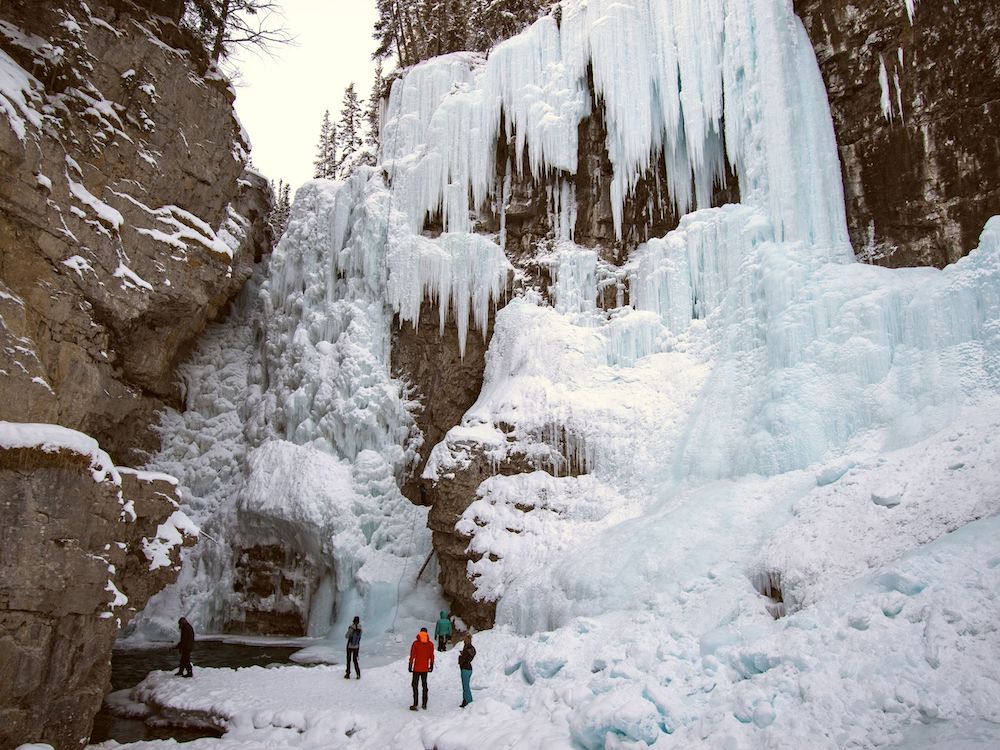 Experiencing the wonders of the Johnston Canyon ice walk is something you absolutely have to do when visiting Banff during the winter months. This guide has everything you need to know before hiking Johnston Canyon in winter. It includes tips on everything from how to prepare, what to wear, special equipment you'll need, how to find the secret cave and more! Pictured here: Johnston Canyon Icewalk Guided Tour