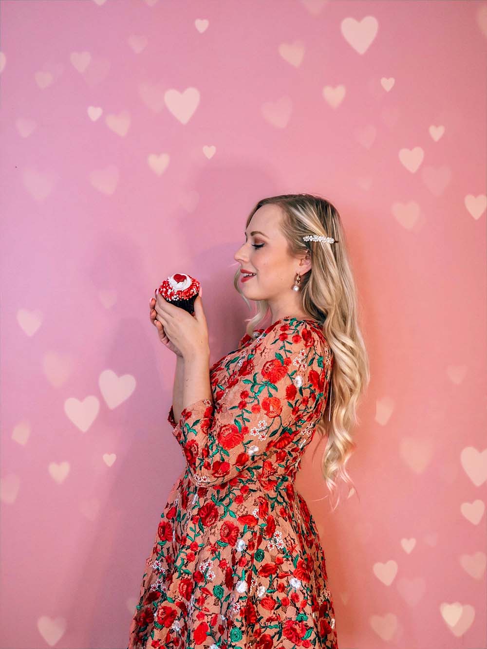 Looking for some fun & creative solo Valentine's Day photoshoot ideas to celebrate you and add a little pink and red to your instagram? This is for you! I've compiled a guide of easy Valentine's day photo ideas you can shoot at home by yourself. All of these ideas involve affordable props and are great for all photography levels. Pictured here: Do a photoshoot against a heart covered wall