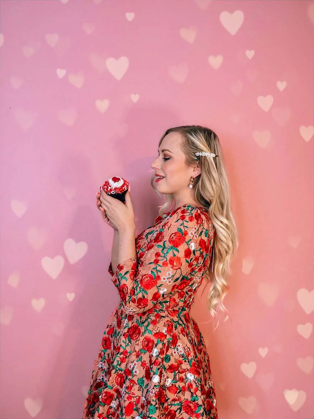 Looking for some fun & creative solo Valentine's Day photoshoot ideas to celebrate you and add a little pink and red to your instagram? This is for you! I've compiled a guide of easy Valentine's day photo ideas you can shoot at home by yourself. All of these ideas involve affordable props and are great for all photography levels. Pictured here: Do a photoshoot against a heart covered wall
