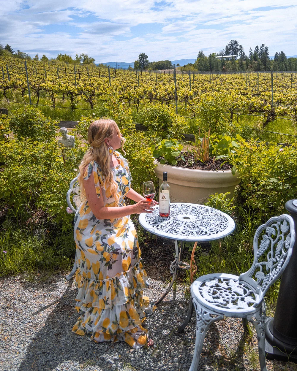 Looking for the best wineries in Kelowna for lunch? This guide is for you! Here's a list of the best Kelowna wineries with restaurants to enjoy an amazing lunch with wine in the sun. Pictured here: Ancient Hill Winery