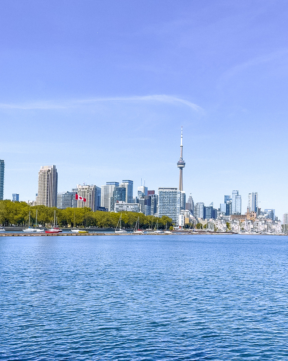 Looking for an incredible place to enjoy your next picnic in Toronto? This guide features some of the best picnic spots in Toronto from a local's perspective. Whether you're looking to picnic in a park, to spend your day sunning and snacking on a beach, prefer a garden hang, or want to check out a more unique destination, this guide has all of the best picnic spots for you to choose from. Pictured here: Trillium Park