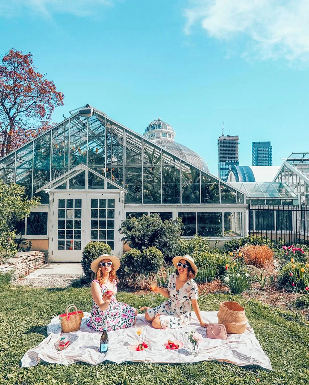 Looking for an incredible place to enjoy your next picnic in Toronto? This guide features some of the best picnic spots in Toronto from a local's perspective. Whether you're looking to picnic in a park, to spend your day sunning and snacking on a beach, prefer a garden hang, or want to check out a more unique destination, this guide has all of the best picnic spots for you to choose from. Pictured here: Allan Gardens