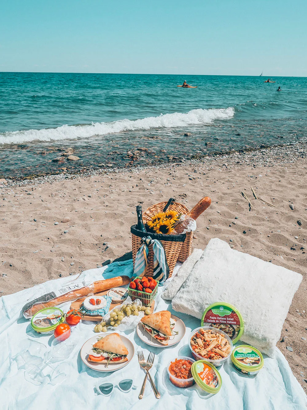 Looking for an incredible place to enjoy your next picnic in Toronto? This guide features some of the best picnic spots in Toronto from a local's perspective. Whether you're looking to picnic in a park, to spend your day sunning and snacking on a beach, prefer a garden hang, or want to check out a more unique destination, this guide has all of the best picnic spots for you to choose from. Pictured here: Woodbine Beach