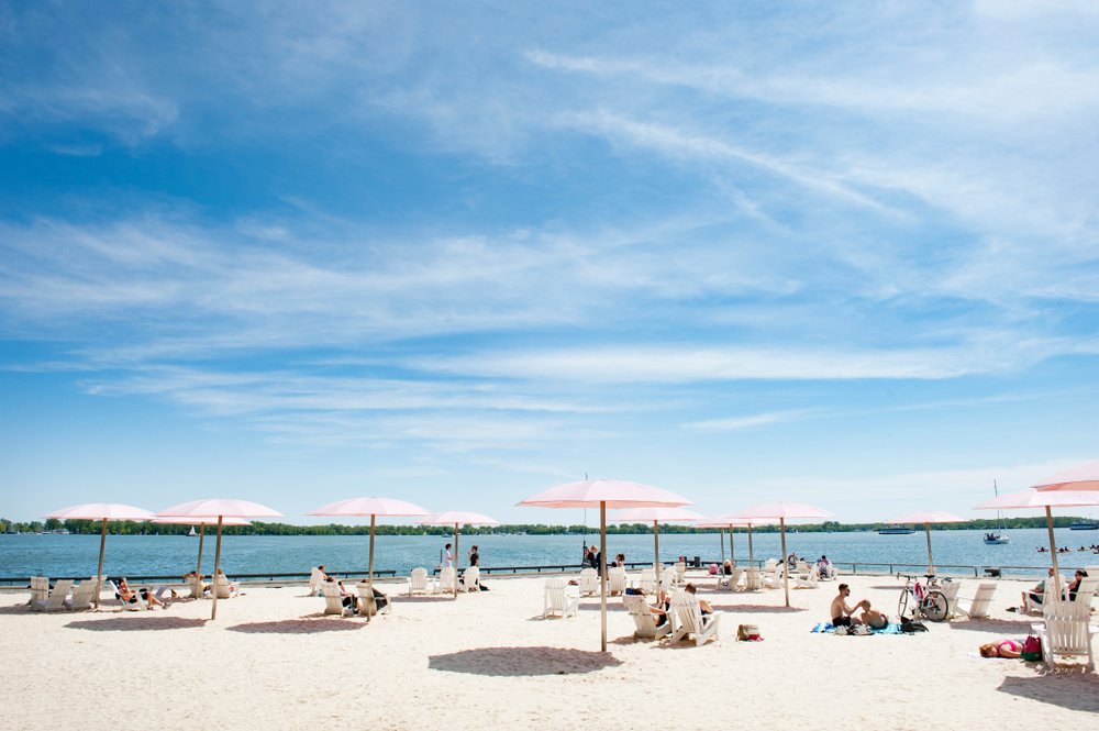 Looking for a great beach to spend a hot summer day laying in the sun on? This guide to the best beaches in Toronto is for you! Whether you're looking for a relaxing and quiet beach hang, the perfect beach for a family picnic, or want to enjoy the beach life in a more lively environment, there is Toronto beach for you. Pictured here: Sugar Beach