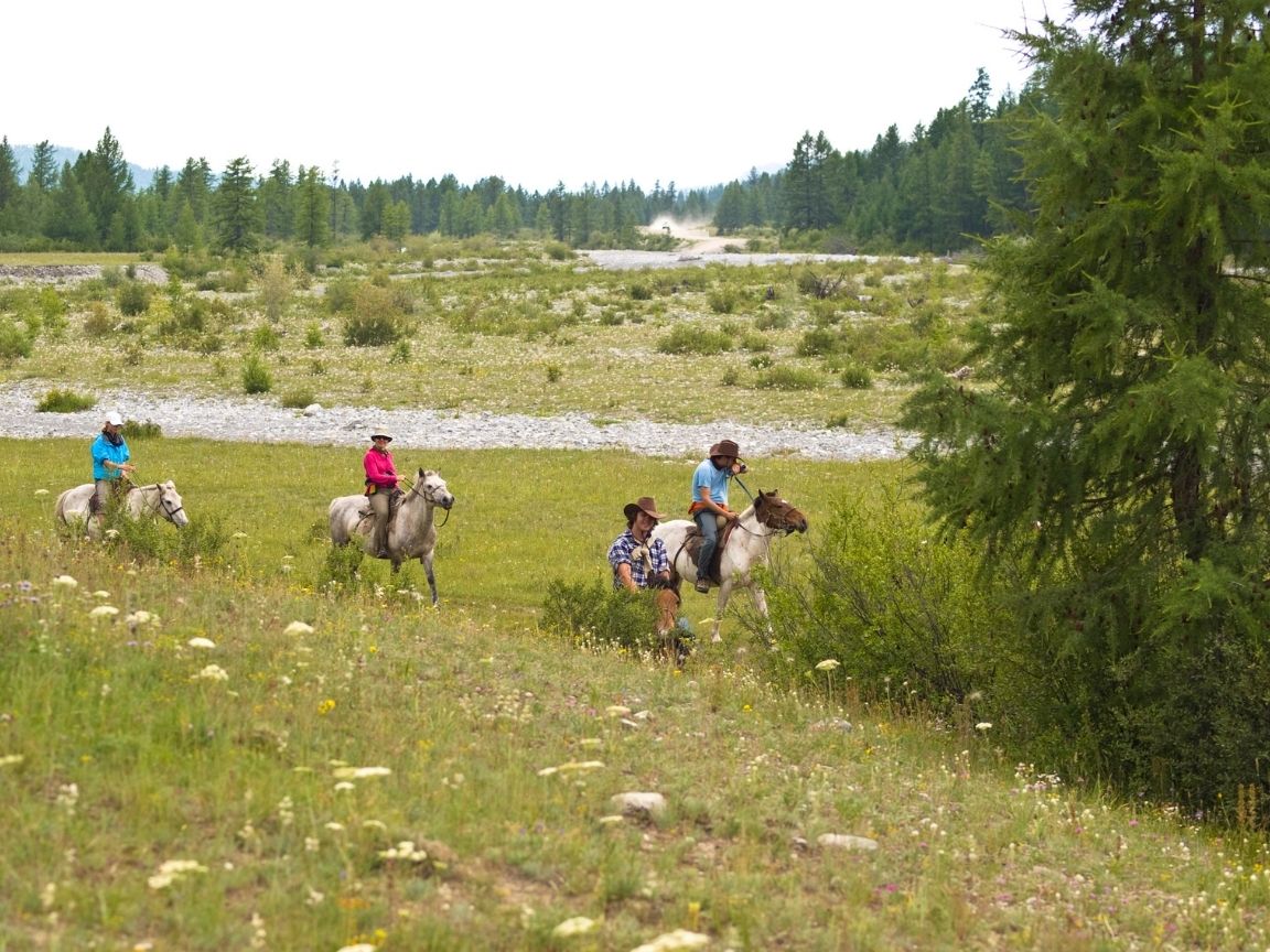 Planning a trip to Kelowna soon? This guide covers all the best things to do in Kelowna from a locals perspective! From wineries and cideries, to adventure activities, hikes, waters sports and more. This guide has everything you need to plan your visit to beautiful Kelowna! Pictured here: Trail riding at Myra Canyon Ranch