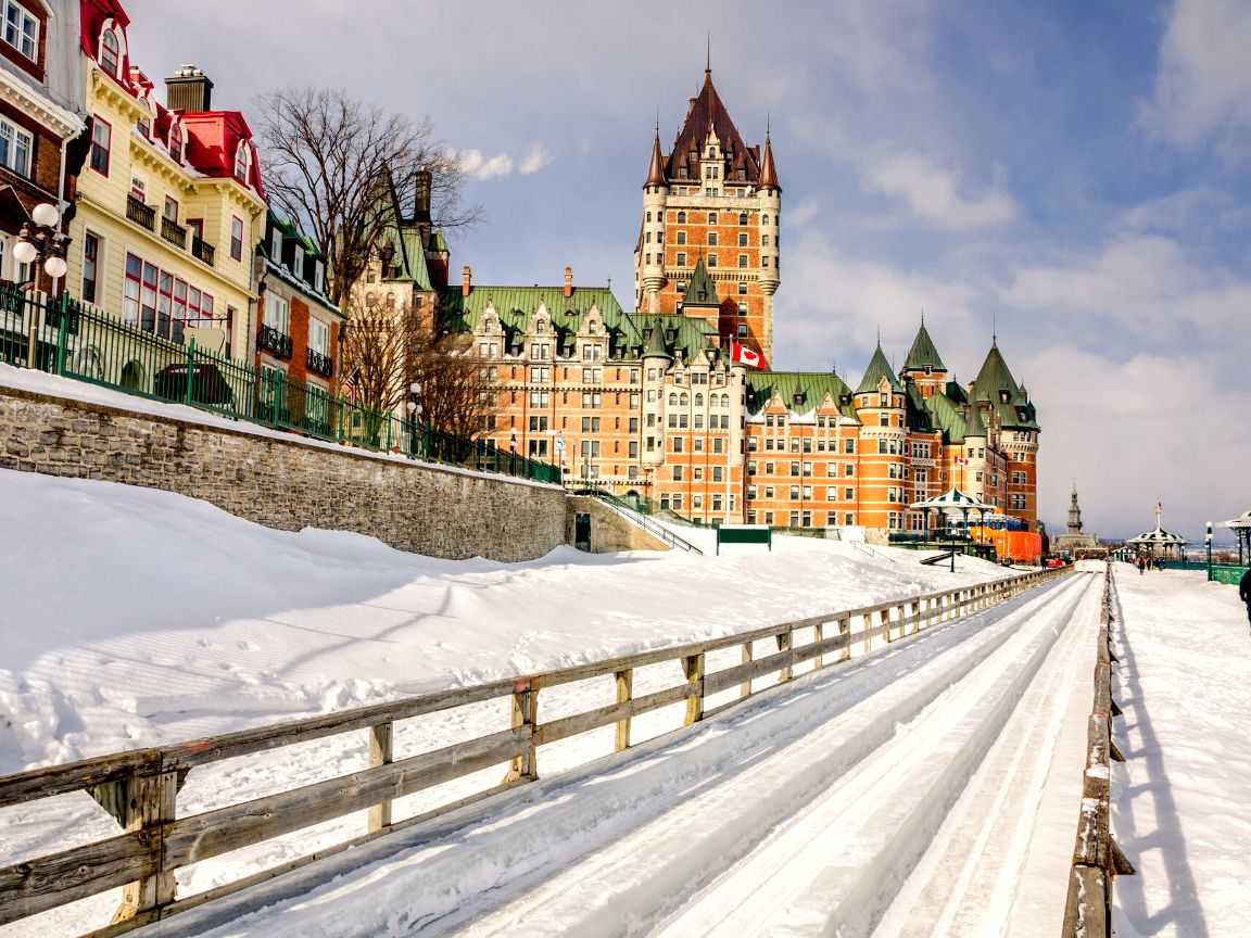 Quebec City at Christmas time is absolutely magical. In fact, it’s pretty safe to say it’s the most magical place to visit at Christmas time in all of Canada! If you’re planning a trip to Quebec City this winter you won’t want to miss this guide to the best things to do in Quebec City at Christmas time. This guide features everything from the top Quebec City activities and attractions, to the must see sights, best restaurants, festive events, and everything in between. Pictured here: Toboggan down Au 1884 slide
