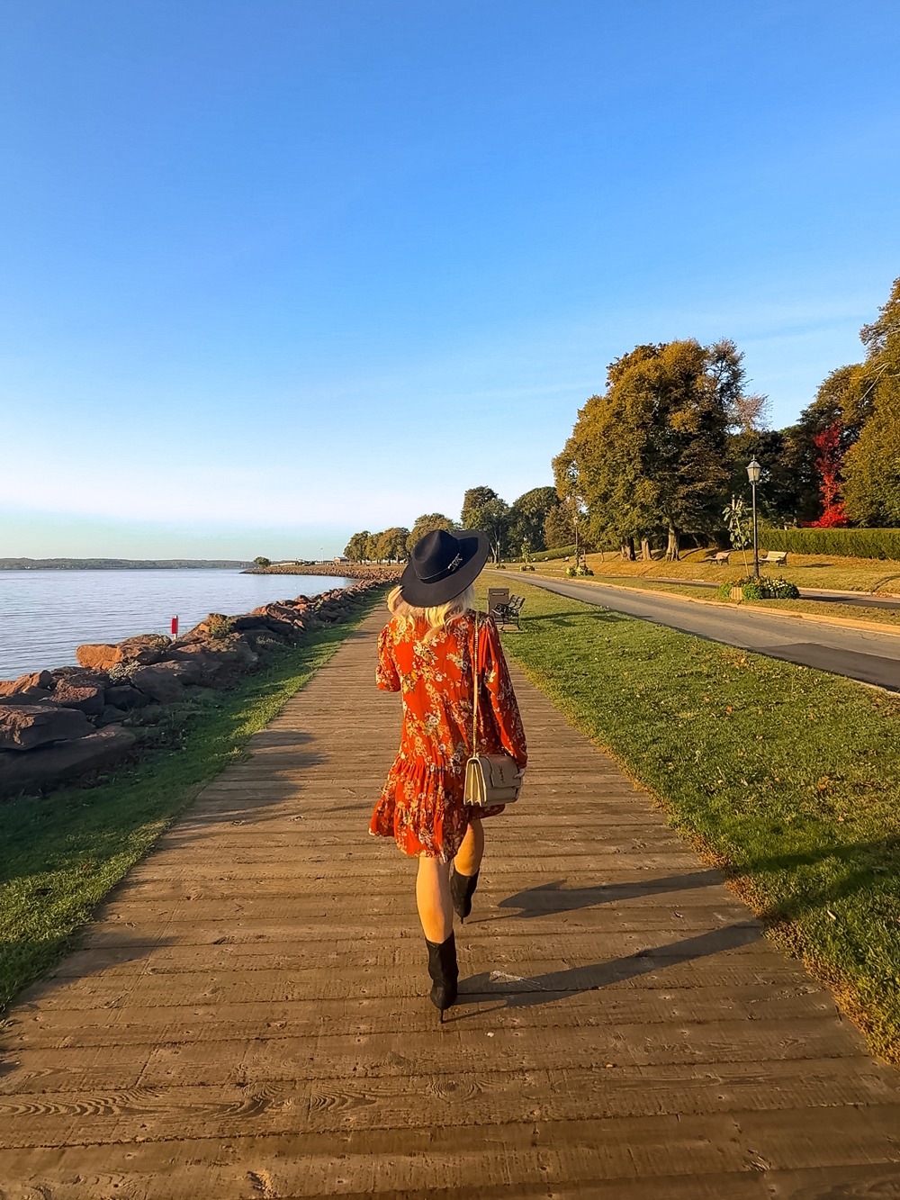 Strolling along the Victoria Park Boardwalk in Charlottetown, PEI &mdash; golden light over the waterfront on a crisp fall evening.