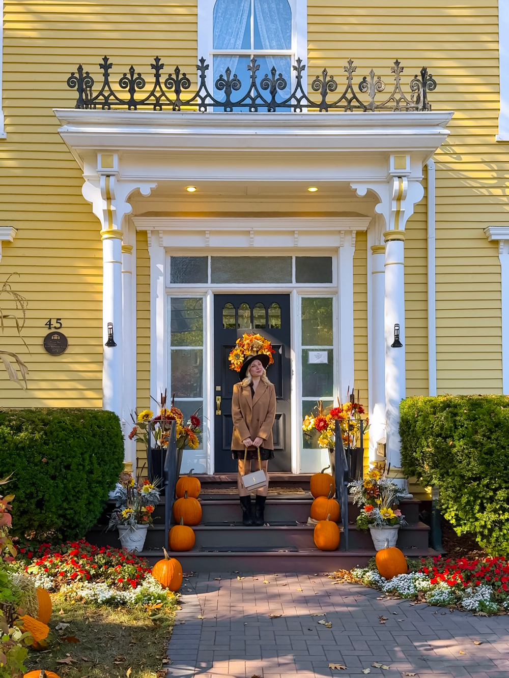 Historic home in Charlottetown decorated with pumpkins and autumn flowers &mdash; celebrating fall charm in Prince Edward Island.