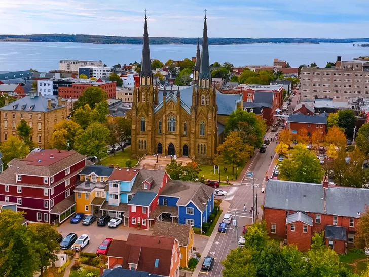Aerial view of downtown Charlottetown, PEI in fall &mdash; St. Dunstan&rsquo;s Basilica surrounded by colorful heritage homes and autumn leaves.