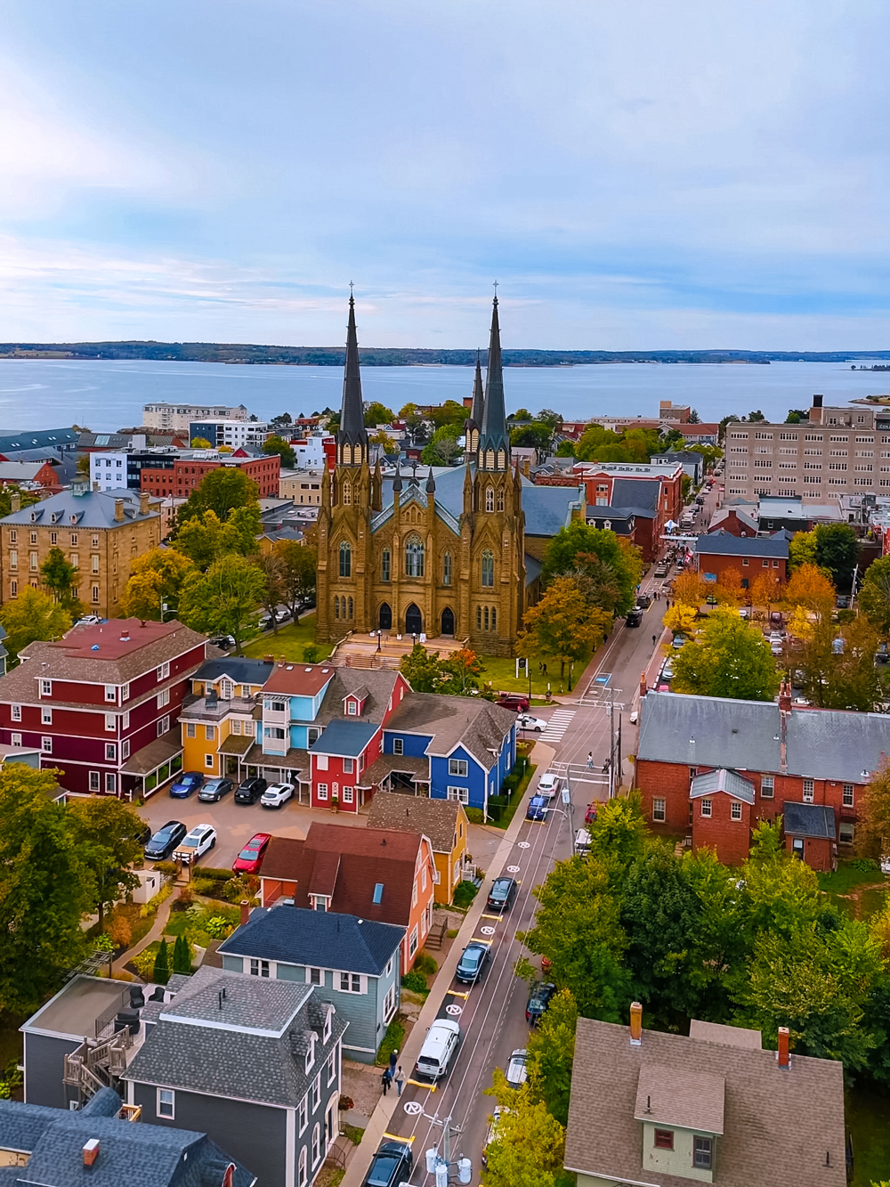 Aerial view of downtown Charlottetown, PEI in fall &mdash; St. Dunstan&rsquo;s Basilica surrounded by colorful heritage homes and autumn leaves.