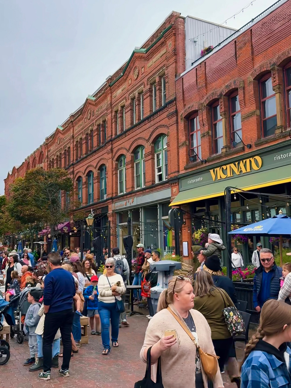 Crowds enjoying Farm Day in the City market in downtown Charlottetown &mdash; live music, food stalls, and fall festivities.