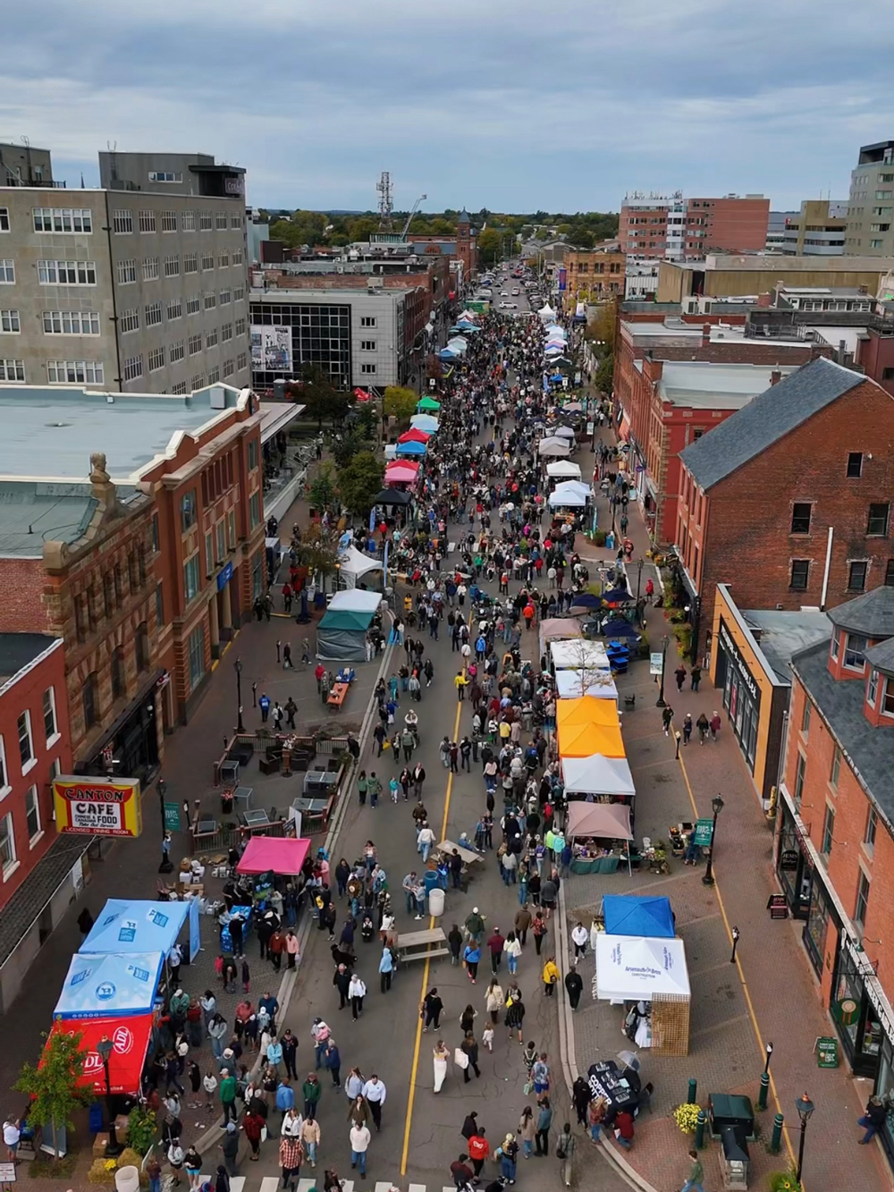 Aerial view of Farm Day in the City festival in Charlottetown, PEI &mdash; easily one of the best things to do in Charlottetown in the fall. Streets filled with market tents and crowds in early October.